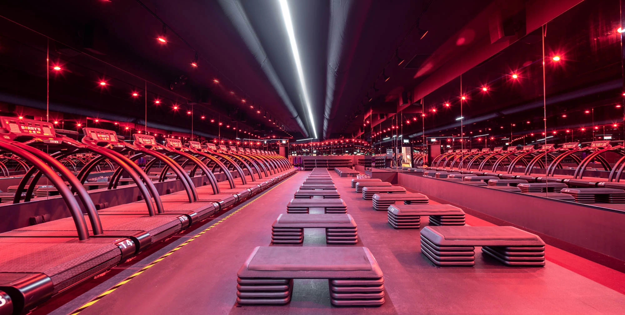 Barry's Bootcamp Singapore Red Room HIIT class with treadmills and weights training