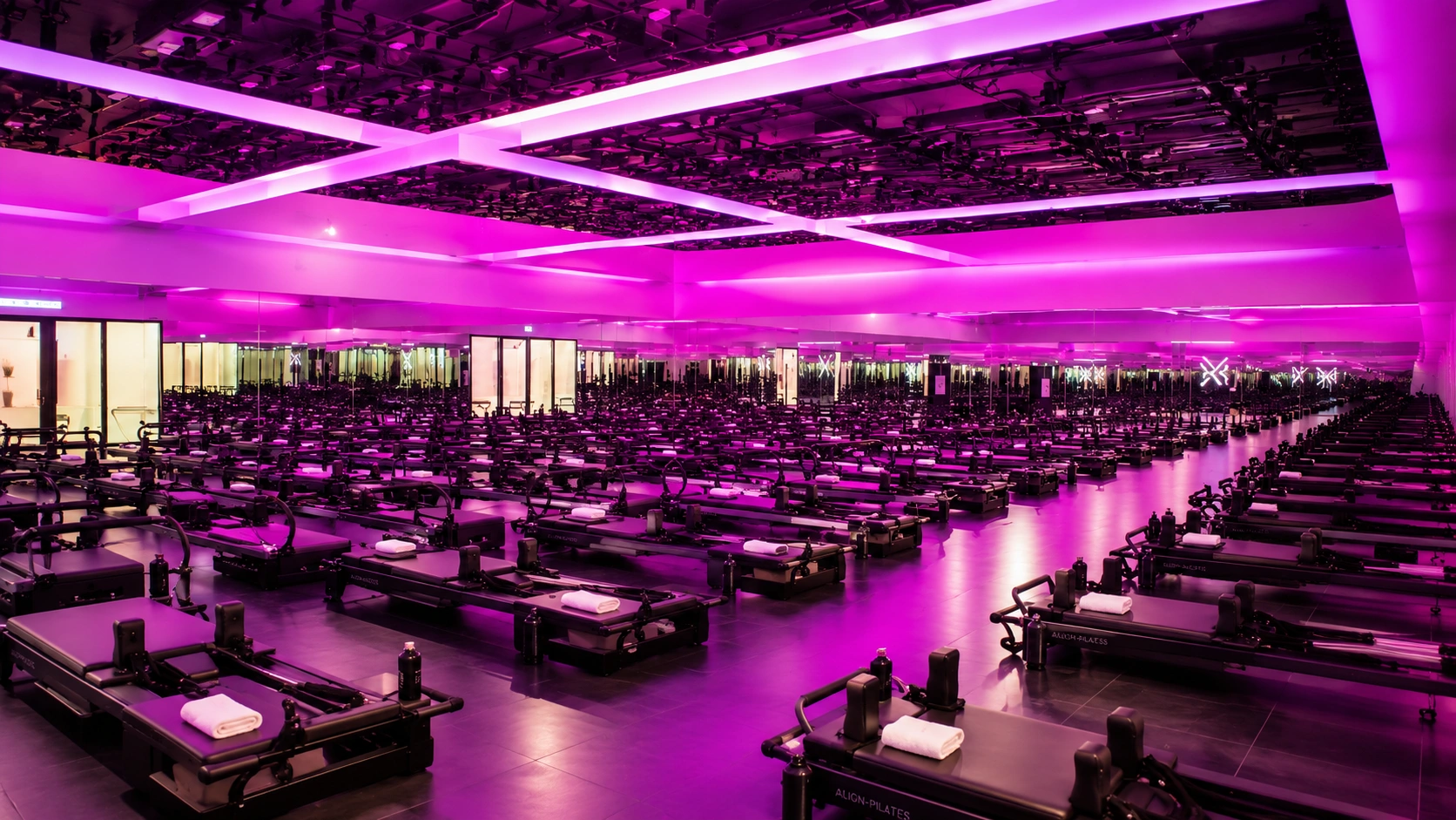 VAURA Pilates Singapore reformer class with light show mirrored ceilings and music